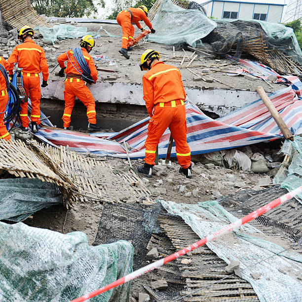 Search and rescue forces search through a destroyed building